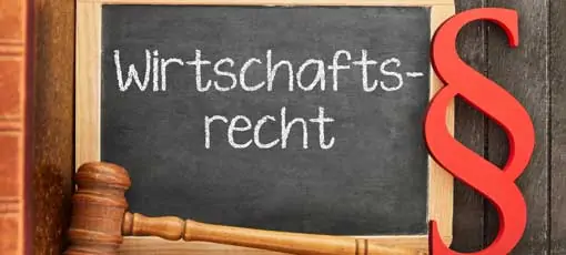 Master in Wirtschaftsrecht - German word Wirtschaftsrecht (commercial law) as concept on a blackboard